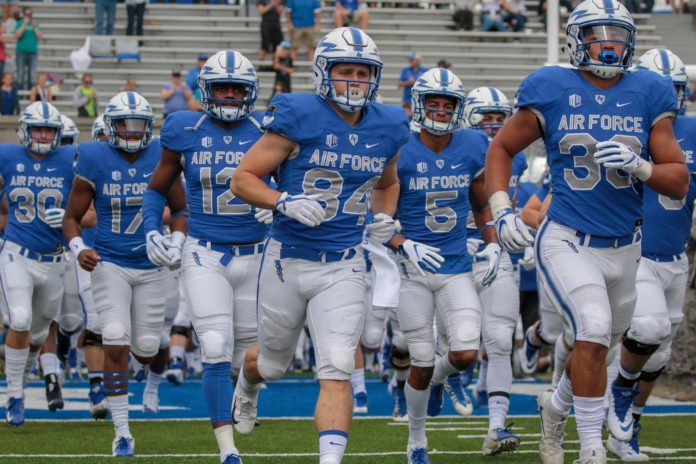 The air force fighting falcons team heading out onto the field.