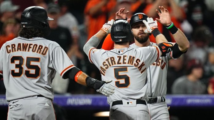 The SF Giants high-fiving during another win.