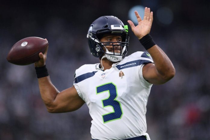 Russel Wilson pictured throwing the football.