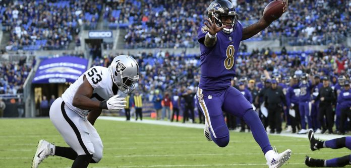 Lamar Jackson going in for a running touchdown against the Raiders.