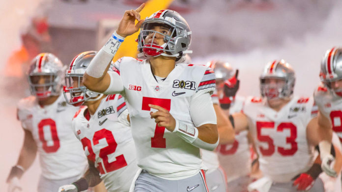 The Ohio State football team running out of the tunnel.