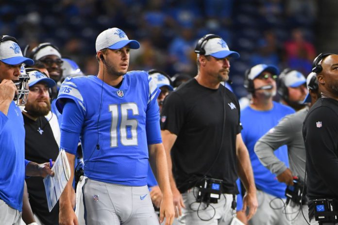 Jared Goff and Dan Campbell side by side.