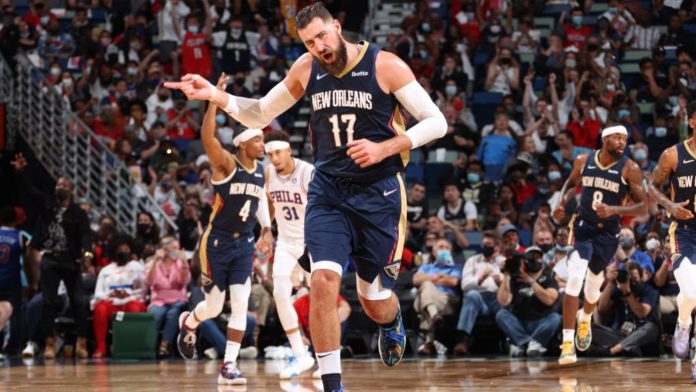 Jonas Valanciunas, dribbling down the court.