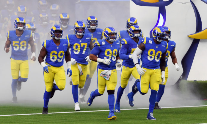 Los Angels Rams defensive lineman Aaron Donald (99) and Michael Brockers (90) leads the team onto the field before the start of an NFL football game against the Chicago Bears, Monday, October 26, 2020 in Inglewood, Calif. The Rams defeated the Bears 24-10. (John Cordes/AP Images for Panini)