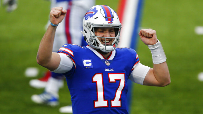 Buffalo Bills quarterback Josh Allen (17) celebrates after throwing a touchdown pass in the first half of an NFL football game against the Miami Dolphins, Sunday, Jan. 3, 2021, in Orchard Park, N.Y. (AP Photo/John Munson)