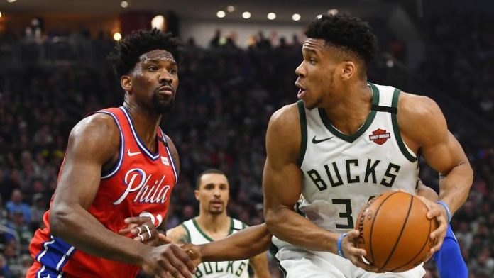 Giannis and Embiid square off in the paint.