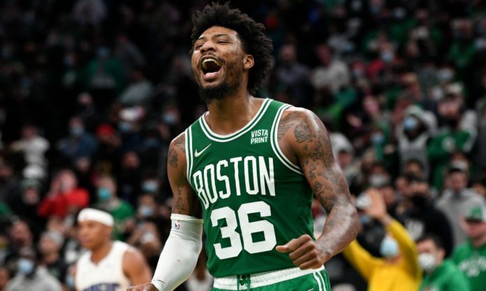 Marcus Smart, the Celtics guard, celebrating on the hardwood.