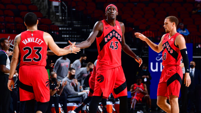 HOUSTON, TX - MARCH 22: Fred VanVleet #23 of the Toronto Raptors high fives Pascal Siakam #43 of the Toronto Raptors during the game against the Houston Rockets on March 22, 2021 at the Toyota Center in Houston, Texas. NOTE TO USER: User expressly acknowledges and agrees that, by downloading and or using this photograph, User is consenting to the terms and conditions of the Getty Images License Agreement. Mandatory Copyright Notice: Copyright 2021 NBAE (Photo by Cato Cataldo/NBAE via Getty Images)