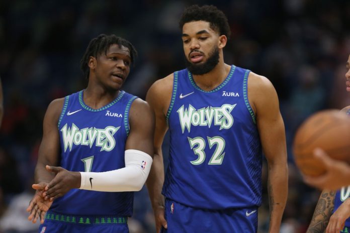 Timberwolves' stars discussing strategy on the court. Photo Courtesy of USA Today