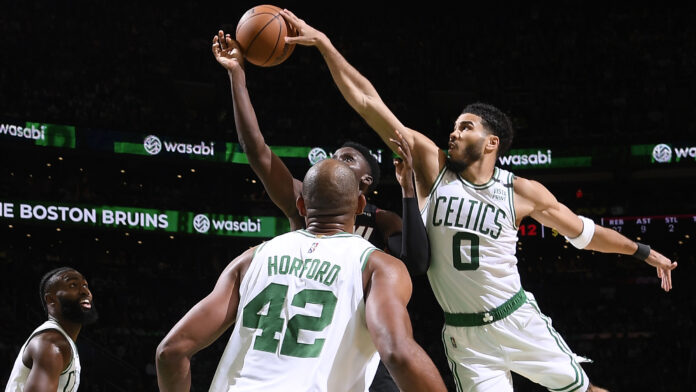 BOSTON, MA - MAY 23: Jayson Tatum #0 of the Boston Celtics blocks the shot of Victor Oladipo #4 of the Miami Heat during Game 4 of the 2022 NBA Playoffs Eastern Conference Finals on May 23, 2022 at the TD Garden in Boston, Massachusetts. NOTE TO USER: User expressly acknowledges and agrees that, by downloading and or using this photograph, User is consenting to the terms and conditions of the Getty Images License Agreement. Mandatory Copyright Notice: Copyright 2022 NBAE (Photo by Brian Babineau/NBAE via Getty Images)