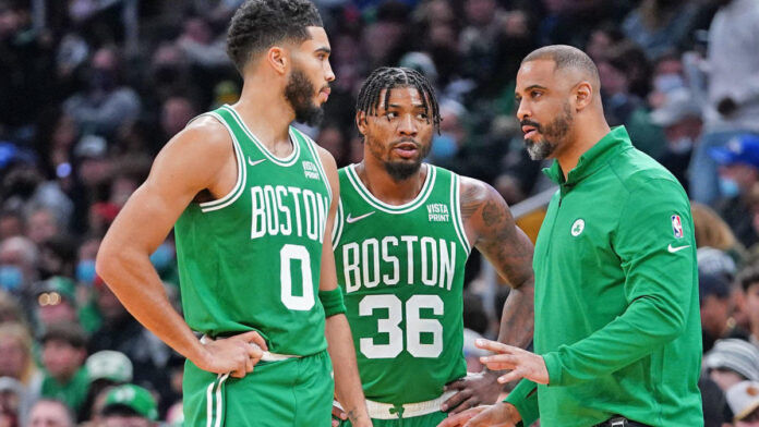 Jayson Tatum, Marcus Smart, and Ime Udoka discussing strategy in the NBA Finals.